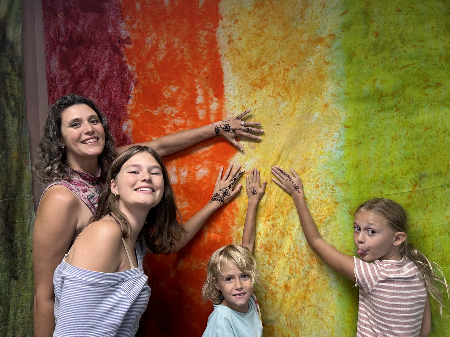 Kelly sharing a joyful moment with three of her daughters
